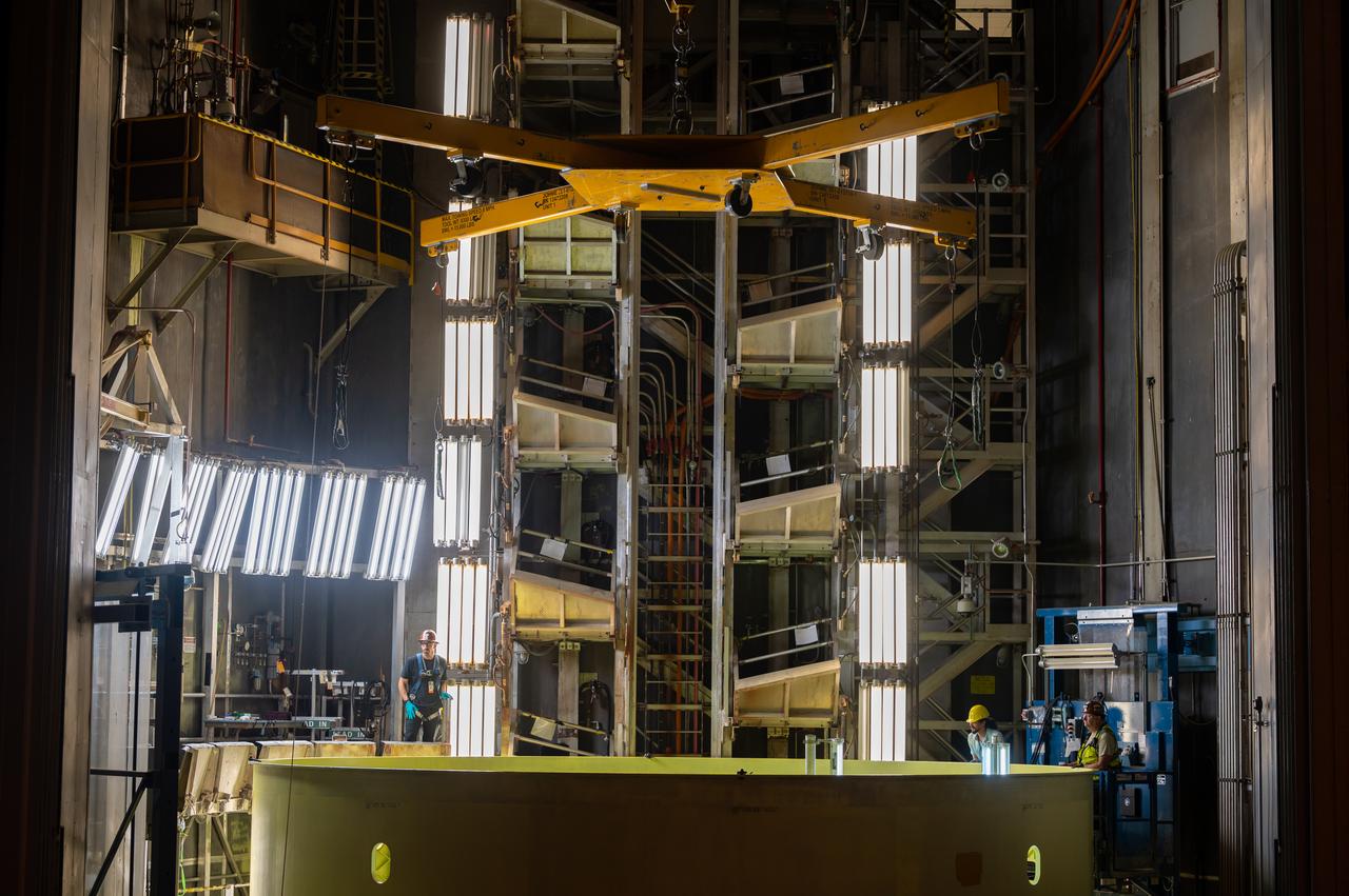 Technicians at NASA’s Michoud Assembly Facility move the engine section of NASA’s Space Launch System rocket for Artemis IV out of Cell G after weld priming. This hardware is the first large piece manufactured for the Artemis IV mission and makes up the lowest portion of the 212-foot-tall core stage. When complete, the engine section will house the four RS-25 engines and include vital systems for mounting, controlling and delivering fuel from the propellant tanks to the rocket’s engines. Together with its four RS-25 engines and its twin solid rocket boosters, it will produce 8.8 million pounds of thrust to send NASA’s Orion spacecraft, astronauts, and supplies beyond Earth’s orbit to the Moon and, ultimately, Mars. Offering more payload mass, volume capability, and energy to speed missions through space, the SLS rocket, along with NASA’s Gateway in lunar orbit, the Human Landing System, and Orion spacecraft, is part of NASA’s backbone for deep space exploration and the Artemis lunar program. No other rocket is capable of carrying astronauts in Orion around the Moon in a single mission.